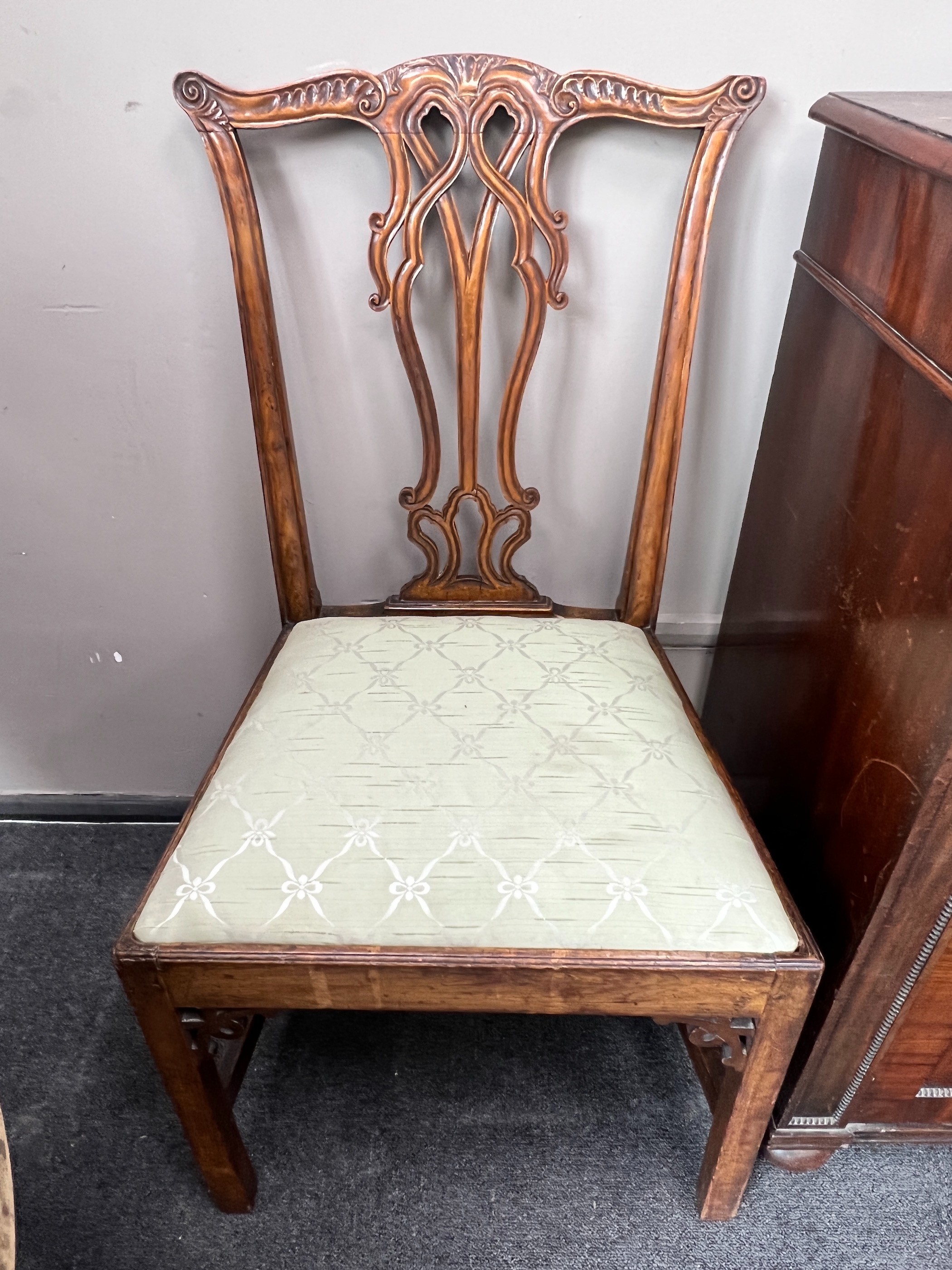 A pair of George III carved mahogany dining chairs
